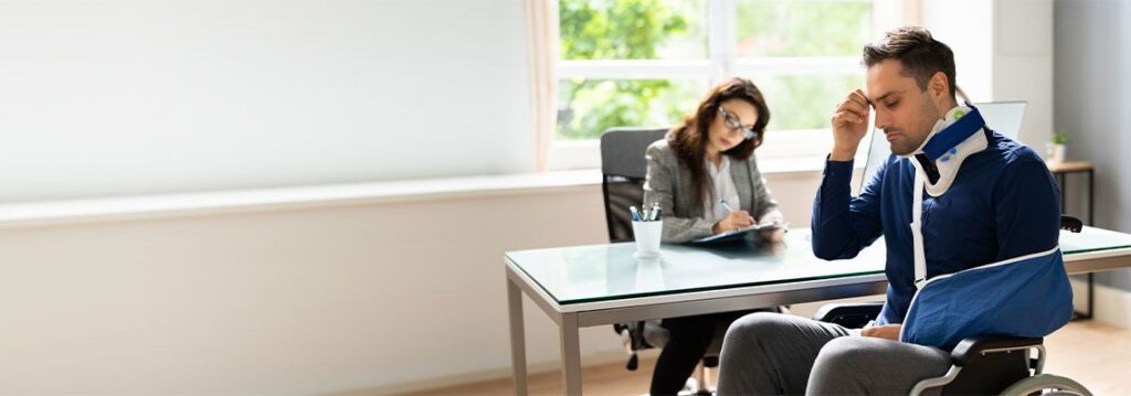 Injured worker stressed reviewing paperwork about closing workers comp case and potential mistakes